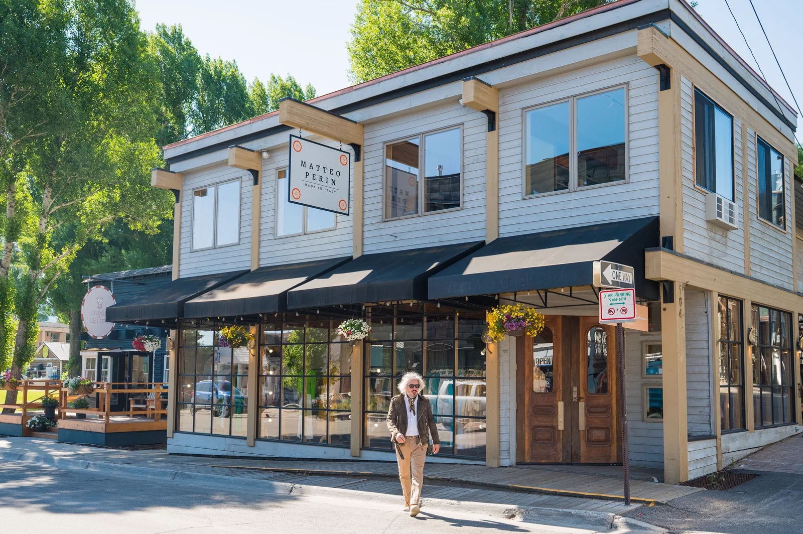 The Matteo Perin — Made in Italy storefront at 164 E Deloney Ave, Jackson, Wyoming, with Matteo crossing the street in front